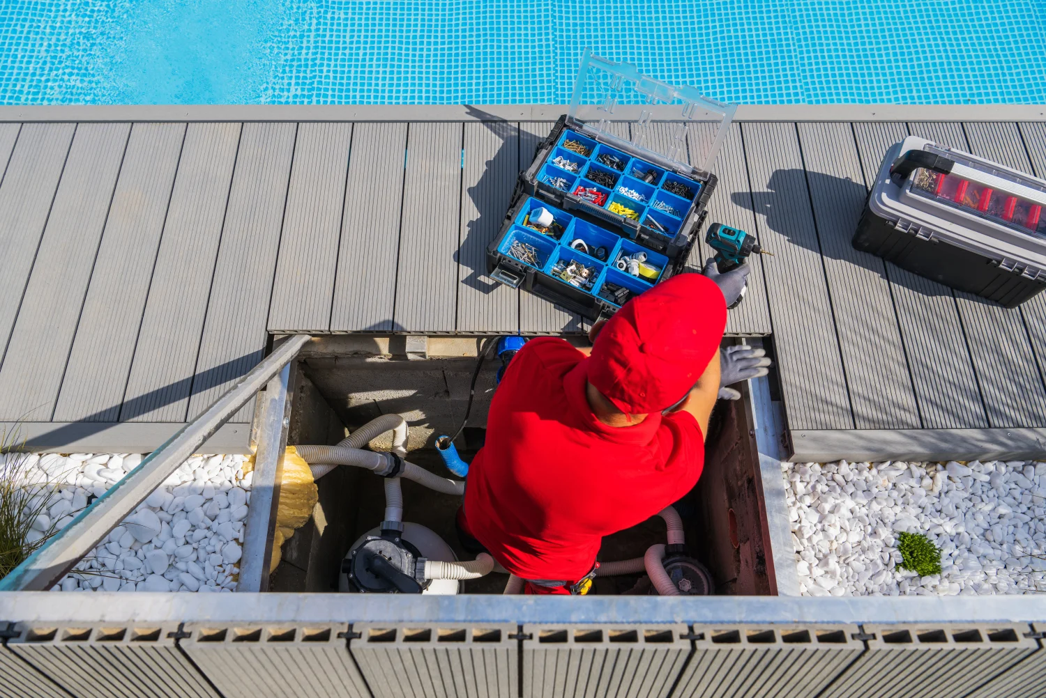 service worker in red doing pool inspection services